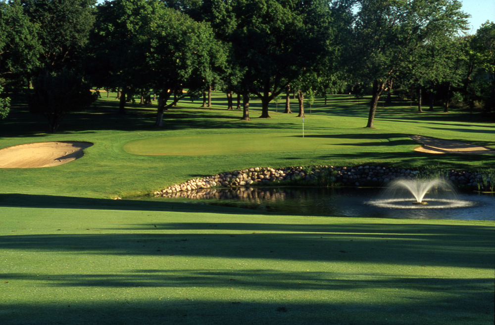 Photo of pond on golf course. 