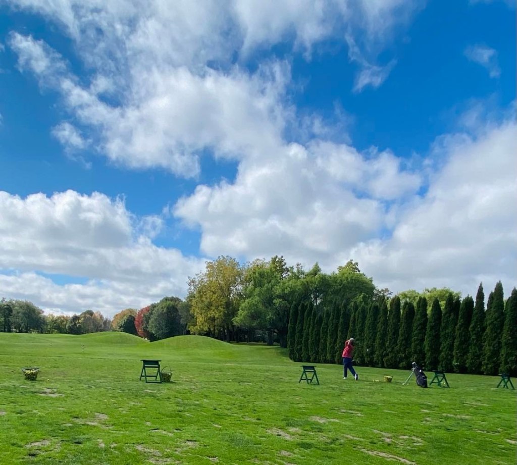 Photo of golfer practicing in the driving range